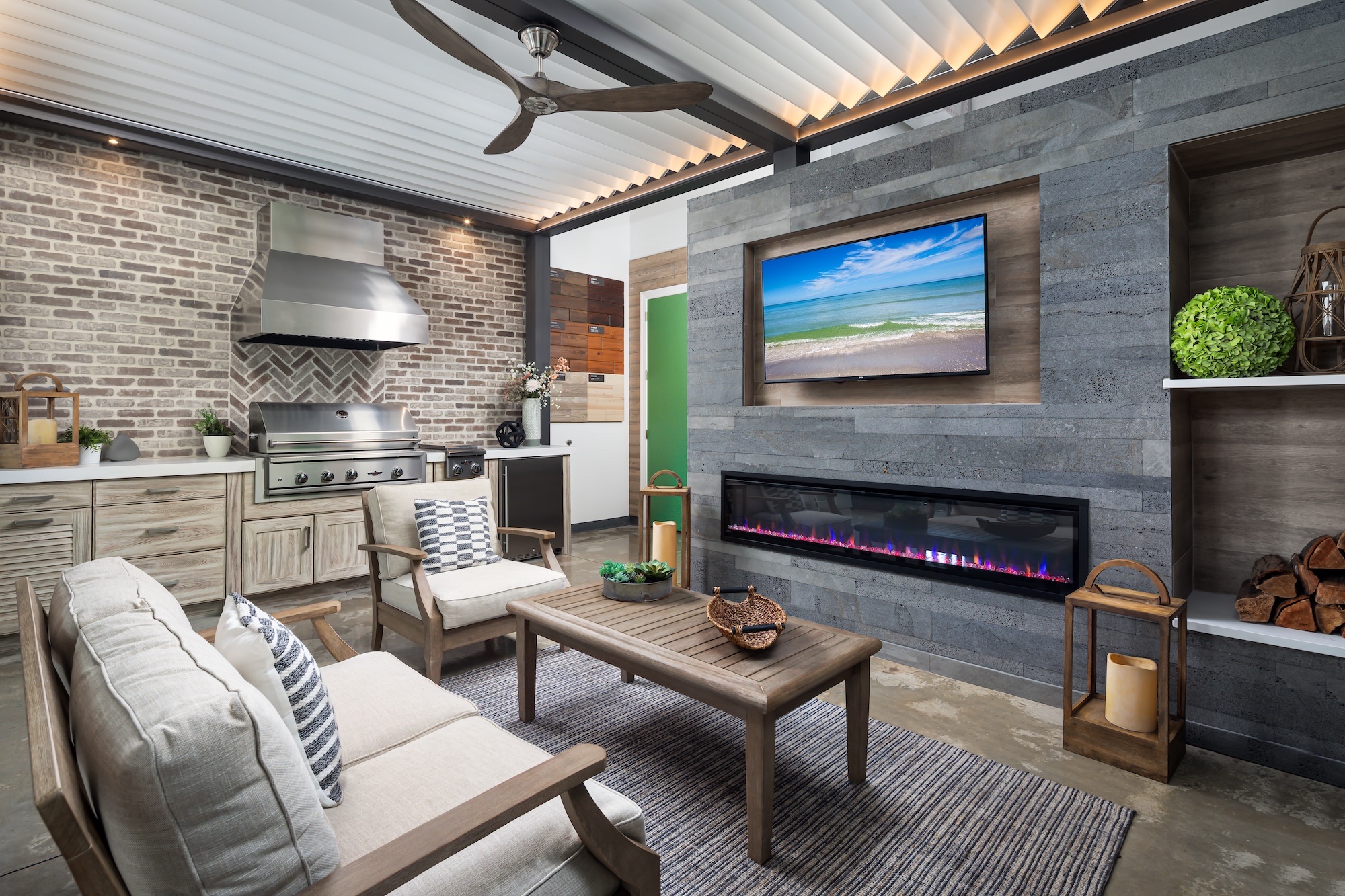 Custom aluminum louvered pergola over an outdoor living room by Knäak Design Group, Naples Florida